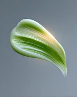 Fresh green leaf floating on gray background, minimalist nature composition with soft lighting and delicate texture details. Isolated design element for creative projects.