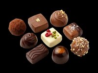 Assorted chocolate bonbons and truffles isolated on transparent background, ready for confectionery design, packaging, menus, print-on-demand products and culinary graphics.