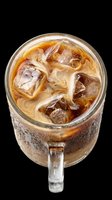 Iced coffee drink in glass mug with ice cubes and creamy liquid, isolated on transparent background. Ready for beverage menu design, t-shirt graphics, print-on-demand products, and digital marketing materials.