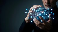 Businessman holding digital network globe with glowing connections and data nodes, representing global technology, internet connectivity, and digital transformation for business solutions.