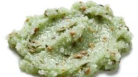 Pistachio slime with glitter and crushed nuts, textured putty for sensory play and stress relief.