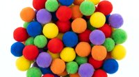 Colorful soft pom poms in rainbow colors isolated on white background for crafting, DIY projects, and creative activities.