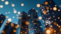 Modern skyscrapers against dark blue evening sky with blurred bokeh lights creating magical urban atmosphere. Glass office buildings illuminated at dusk.