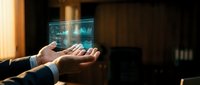 Young male professional holding glowing digital hologram display with data visualization and network connections, representing technology innovation, business solutions, and future digital transformation.