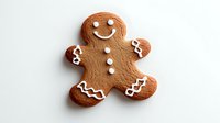 Smiling gingerbread cookie decorated with white icing details on neutral background, festive holiday baking and traditional Christmas sweet treat.