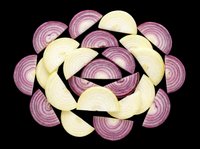 Sliced red and white onion pieces arranged in a circular pattern, isolated on transparent background, ready for food design, stickers, t-shirts, and print on demand.