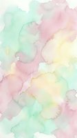 Soft pastel watercolor background with gentle pink, green and yellow washes blending organically for creative projects and artistic designs.