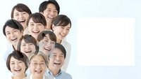 Happy diverse group of Asian friends and colleagues laughing together in casual white shirts with copy space for text or logo design.