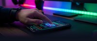 Close-up of hand touching smartphone screen with neon lighting effects in background, suitable for technology, mobile apps, digital innovation, and modern communication concepts.