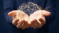 Person in professional attire holding glowing digital globe network in cupped hands, representing global connectivity, technology innovation, and worldwide business communication solutions.