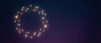 Warm glowing lights arranged in circular wreath formation against dark night sky background, suitable for holiday, festive, and seasonal design projects.