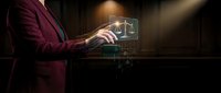 Professional lawyer or attorney using digital technology with glowing scales of justice hologram, representing modern legal services and law practice innovation.