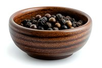 Whole black peppercorns in wooden bowl against white background, aromatic spice and seasoning ingredient for cooking and food preparation.