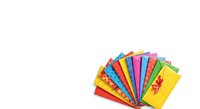 Isolated colorful paper fan arrangement displaying vibrant rainbow hues in red, orange, yellow, green, blue, and pink tones, perfect for design projects and creative backgrounds.