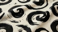 Abstract black swirls and circular brushstrokes on cream textured background, seamless pattern tiles into single continuous design for wallpaper and fabric.