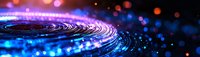 Abstract circular light trails with blue and red bokeh effects creating dynamic motion pattern against dark background. Futuristic technology concept.