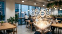 Hands holding glowing gear icons representing digital transformation, innovation, and business process automation in modern office workspace.