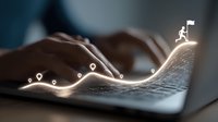 Hands typing on laptop keyboard with glowing path and location pins, illustrating digital journey to success with figure reaching summit.