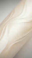 Soft cream silk fabric with elegant flowing folds and luxurious texture for fashion design and textile backgrounds.