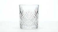 Crystal cut glass tumbler with diamond pattern isolated on white background for luxury drinkware and elegant dining presentations.