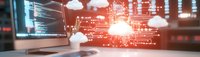 Cloud computing technology concept with glowing red digital interface and computer workstation showing data transfer and network connectivity.