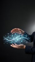 Businessman holding digital network visualization with glowing geometric shapes and connected nodes between hands against dark background for technology and innovation concepts.