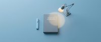 Theory of knowledge book with glowing desk lamp and pen on soft blue background, symbolizing study, education, and intellectual exploration.