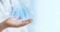 Medical professional holding holographic lungs projection for respiratory health education and pulmonary care concepts in healthcare technology.