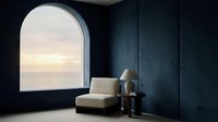Minimalist interior with cream armchair facing arched window overlooking serene seascape at sunset, dark walls, modern home decor and relaxation space.