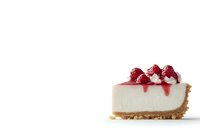 Slice of creamy cheesecake topped with fresh raspberries and red sauce on graham cracker crust against white background, isolated food photography.
