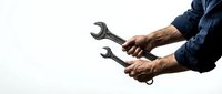 Male mechanic hands holding metal wrenches against white background. Professional automotive repair tools for maintenance and mechanical work projects.