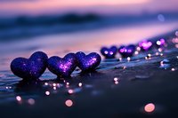 Purple glowing hearts on wet surface with bokeh lights in twilight creating romantic atmosphere, love concept for Valentine's day and wedding designs.