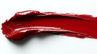 Red lipstick smear stroke isolated on white background. Cosmetic makeup texture for beauty and fashion design projects.
