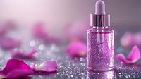 Pink glittery serum dropper bottle with rose petals and sparkles on reflective surface against blurred floral background, cosmetic product photography.