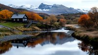 Tranquil mountain cabin reflects in calm lake waters surrounded by vibrant autumn foliage, snow-capped peaks and rugged terrain creating serene Nordic landscape.