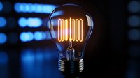 Glowing light bulb with illuminated action text inside on dark background with bokeh effect. Creative concept for motivation and inspiration.