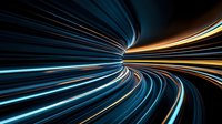 Dynamic light trails creating futuristic tunnel effect with blue and orange glowing streaks against dark background, suggesting high-speed motion and technology advancement.