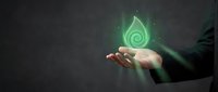 Business professional holding glowing green energy spiral symbol representing sustainability, renewable power and eco-friendly innovation concepts.