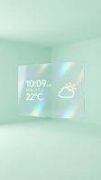Futuristic transparent glass display panel showing digital clock, date and weather forecast with holographic light effects in minimalist mint green room setting.