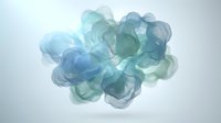 Abstract blue and green watercolor ink clouds flowing in water creating organic fluid shapes for creative design projects and artistic backgrounds.