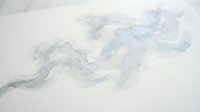 Soft gray and blue watercolor abstract flowing shapes on white paper creating organic fluid movement for artistic backgrounds and creative projects.