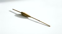 Antique brass syringe with two-pronged needle tip on white background, medical instrument for healthcare and pharmaceutical applications.
