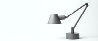 Modern gray adjustable desk lamp with articulated arm on white background, minimalist industrial design for office and home workspace decor.