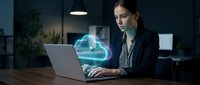 Professional businesswoman working on laptop with holographic cloud computing technology in modern office environment for digital transformation projects.