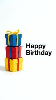 Happy Birthday greeting card with stacked colorful gift boxes in blue, red, and yellow on a white background with bold text.