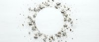 Circular frame made of scattered ash, dust, and debris particles isolated on white background, suitable for design overlays, digital compositing, and creative projects.