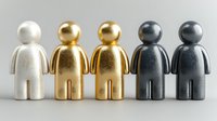 Metallic figurines representing diversity concept with silver, gold, and dark gray human-shaped characters standing in row on neutral background.