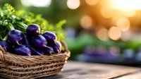 Fresh purple beets in rustic woven basket on wooden surface with green herbs and golden bokeh background, natural organic farm produce.