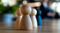 Wooden game piece on blurred background, symbolizing leadership, human resources and business strategy concepts. Focus on single pawn figure.