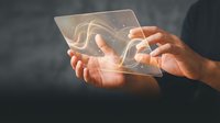 Hands holding transparent tablet with glowing neural network hologram, futuristic technology concept for digital innovation and artificial intelligence applications.